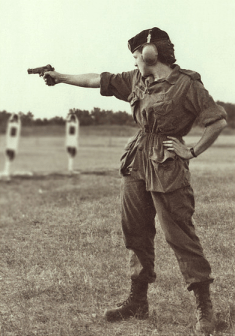 A Hi-Power user adopts the once-popular Larry Grayson stance.